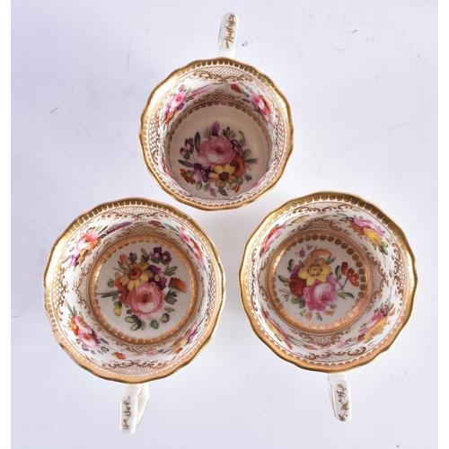 1414 - A PAIR OF EARLY 19TH CENTURY COALPORT PORCELAIN CUPS AND SAUCERS together with another matching cup ... 