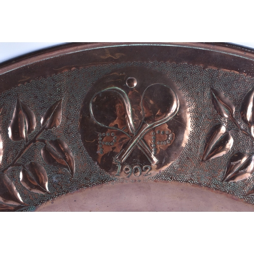 1419 - A LARGE ARTS AND CRAFTS COPPER REPOUSSE WALL CHARGER signed PP, together with a pair of Art Nouveau ... 