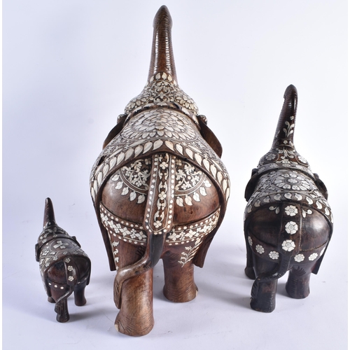 1421 - THREE ANTIQUE ANGLO INDIAN CARVED HARDWOOD BONE INLAID ELEPHANTS. Largest 46 cm x 30 cm. (3)