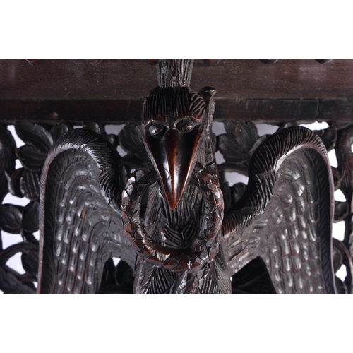 1438 - AN UNUSUAL 19TH CENTURY ANGLO INDIAN CARVED HARDWOOD HANGING PEDESTAL STAND formed with a bird with ... 