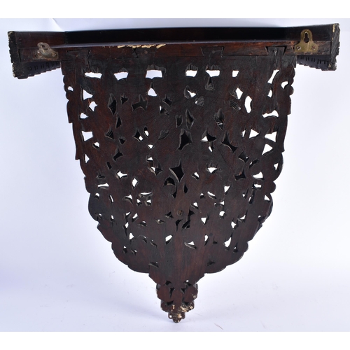 1438 - AN UNUSUAL 19TH CENTURY ANGLO INDIAN CARVED HARDWOOD HANGING PEDESTAL STAND formed with a bird with ... 