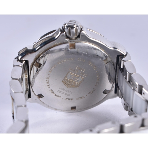 1442 - A FULL SET TAG HEUER WRISTWATCH. 3.25 cm wide inc winder.