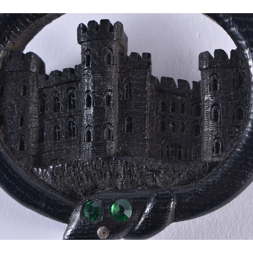 1443 - A LOVELY VICTORIAN IRISH BOG OAK CASTLE AND SERPENT BROOCH inscribed to the back Aug 1853. 6.5 cm x ... 