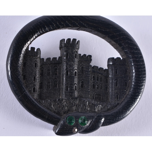 1443 - A LOVELY VICTORIAN IRISH BOG OAK CASTLE AND SERPENT BROOCH inscribed to the back Aug 1853. 6.5 cm x ... 