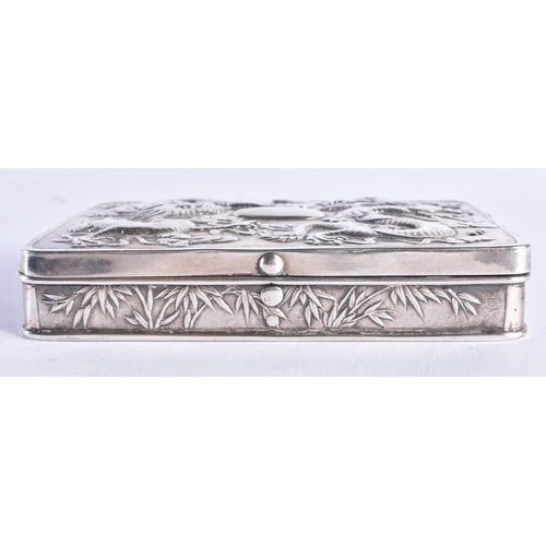 1446 - A 19TH CENTURY CHINESE EXPORT SILVER DRAGON BOX stamped WHL, depicting dragons in relief amongst clo... 