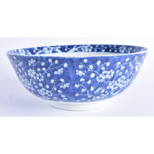 1451 - A 19TH CENTURY CHINESE BLUE AND WHITE PORCELAIN BOWL Qing, painted with prunus and flowers. 20 cm di... 