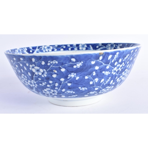 1451 - A 19TH CENTURY CHINESE BLUE AND WHITE PORCELAIN BOWL Qing, painted with prunus and flowers. 20 cm di... 