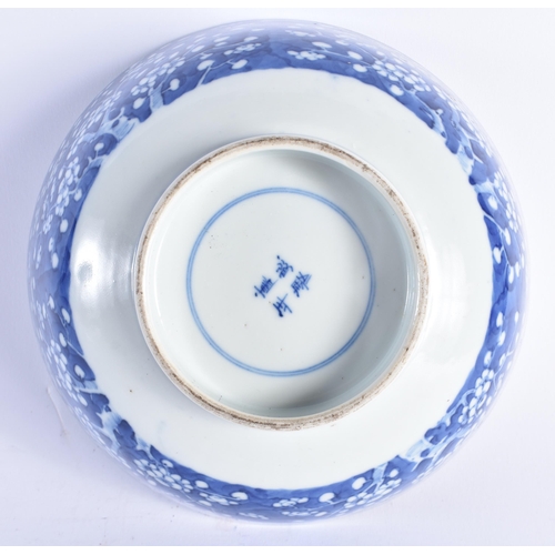 1451 - A 19TH CENTURY CHINESE BLUE AND WHITE PORCELAIN BOWL Qing, painted with prunus and flowers. 20 cm di... 