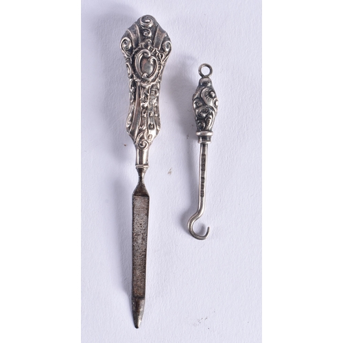 1459 - A PAIR OF ANTIQUE SILVER CASED SCISSORS together with other silver sewing tools. 52 grams overall. (... 