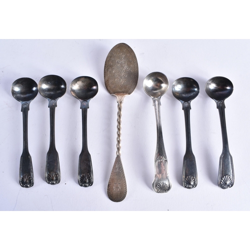 1469 - AN UNUSUAL VICTORIAN NEWCASTLE SILVER SLICE SPOON by Christian John Reid, together with six silver s... 