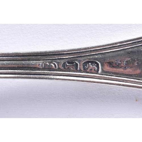 1469 - AN UNUSUAL VICTORIAN NEWCASTLE SILVER SLICE SPOON by Christian John Reid, together with six silver s... 