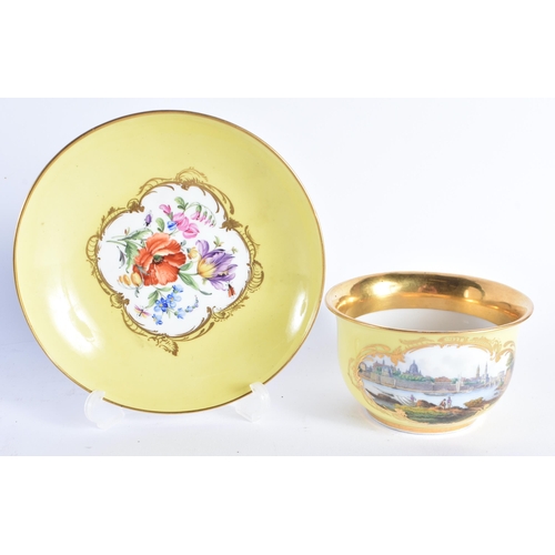 1475 - A 19TH CENTURY MEISSEN OVERSIZED PORCELAIN CUP AND SAUCER painted with views of Dresden and floral s... 