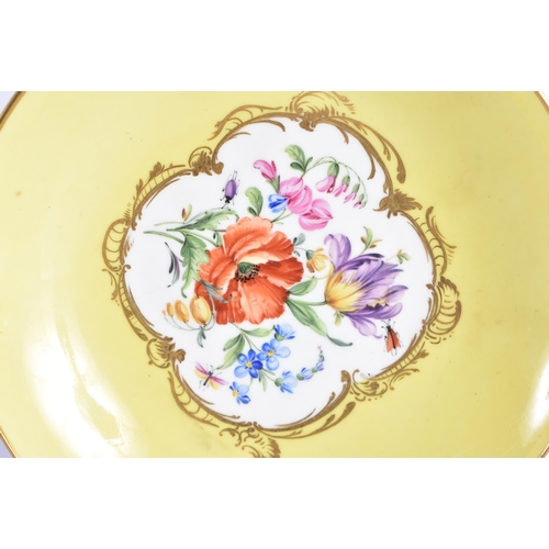 1475 - A 19TH CENTURY MEISSEN OVERSIZED PORCELAIN CUP AND SAUCER painted with views of Dresden and floral s... 