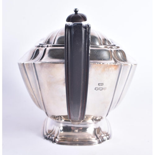 1476 - AN ART DECO SHEFFIELD SILVER TEAPOT. 568 grams. 26 cm wide.