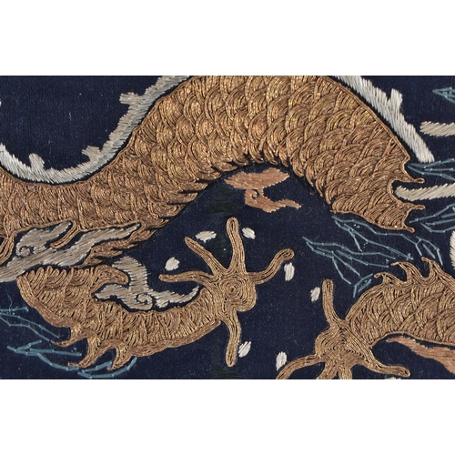 1482 - A 19TH CENTURY CHINESE SILK EMBROIDERED DRAGON PANEL Qing. 62 cm x 28 cm.