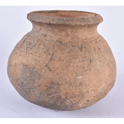 1492 - AN EARLY ANTIQUITY POTTERY VESSEL together with a similar head. Largest 14 cm x 16 cm. (2)