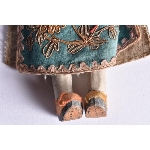 1493 - A PAIR OF LATE 19TH CENTURY SILK EMBROIDERED PUPPETS with pottery heads. 25 cm long.