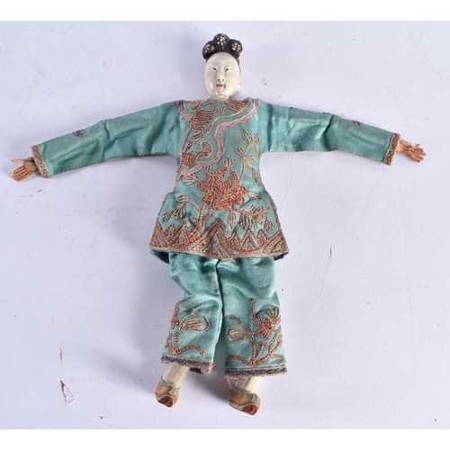 1493 - A PAIR OF LATE 19TH CENTURY SILK EMBROIDERED PUPPETS with pottery heads. 25 cm long.