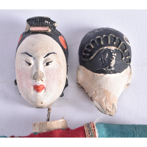 1493 - A PAIR OF LATE 19TH CENTURY SILK EMBROIDERED PUPPETS with pottery heads. 25 cm long.