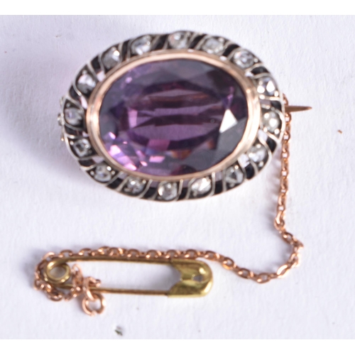 1518 - AN ANTIQUE AMETHYST YELLOW AND WHITE METAL BROOCH. 7.3 grams. 2.5 cm x 1.75 cm.