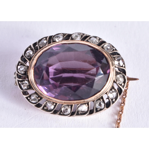 1518 - AN ANTIQUE AMETHYST YELLOW AND WHITE METAL BROOCH. 7.3 grams. 2.5 cm x 1.75 cm.