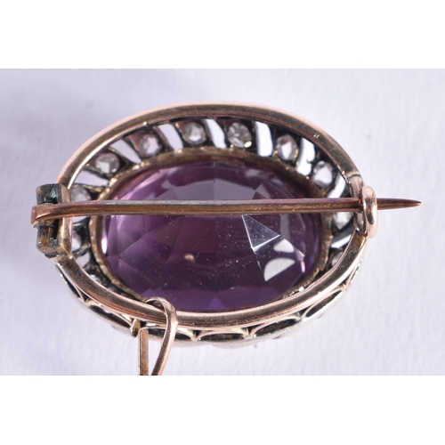 1518 - AN ANTIQUE AMETHYST YELLOW AND WHITE METAL BROOCH. 7.3 grams. 2.5 cm x 1.75 cm.