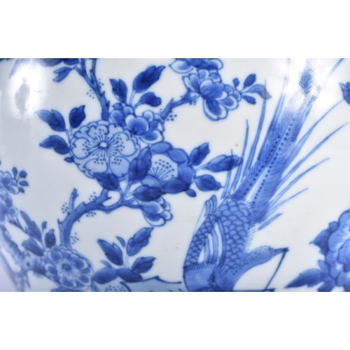 1532 - A FINE 17TH CENTURY CHINESE BLUE AND WHITE PORCELAIN VASE Kangxi, painted with a bird perched upon h... 