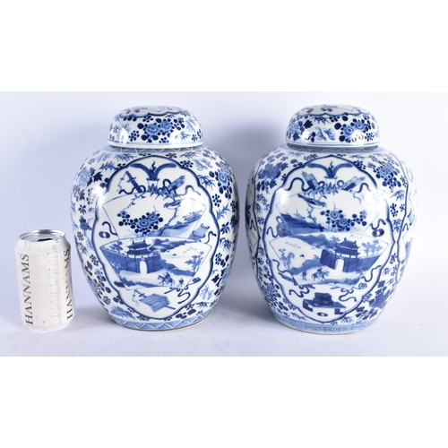 1538 - A LARGE PAIR OF 19TH CENTURY CHINESE BLUE AND WHITE GINGER JARS AND COVERS bearing Kangxi marks to b... 