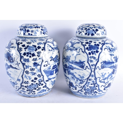 1538 - A LARGE PAIR OF 19TH CENTURY CHINESE BLUE AND WHITE GINGER JARS AND COVERS bearing Kangxi marks to b... 