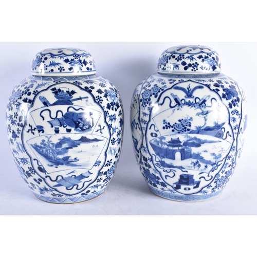 1538 - A LARGE PAIR OF 19TH CENTURY CHINESE BLUE AND WHITE GINGER JARS AND COVERS bearing Kangxi marks to b... 