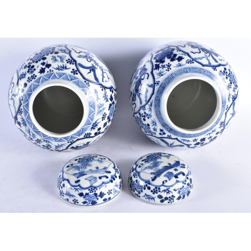 1538 - A LARGE PAIR OF 19TH CENTURY CHINESE BLUE AND WHITE GINGER JARS AND COVERS bearing Kangxi marks to b... 