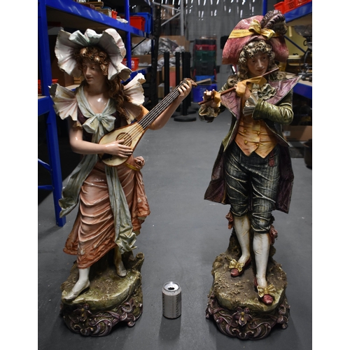 1540 - A MONUMENTAL PAIR OF EARLY 20TH CENTURY AUSTRIAN PORCELAIN FIGURES modelled as a male and female mus... 