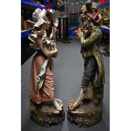 1540 - A MONUMENTAL PAIR OF EARLY 20TH CENTURY AUSTRIAN PORCELAIN FIGURES modelled as a male and female mus... 