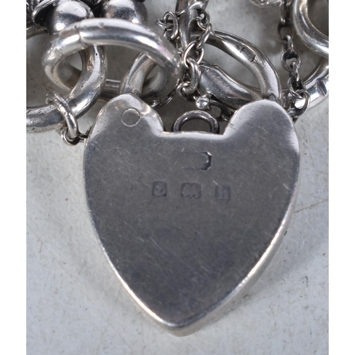 756 - Edwardian Silver Bracelet Conversion Inc. Heart Padlock 22g. Birmingham 1907. 5 cm in diameter.