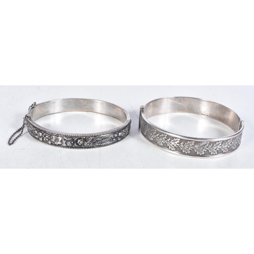 768 - Collection of Silver Bangles Inc. Floral, Safety Chain x 2 53g. 6.25 cm x 5.5 cm. (2)