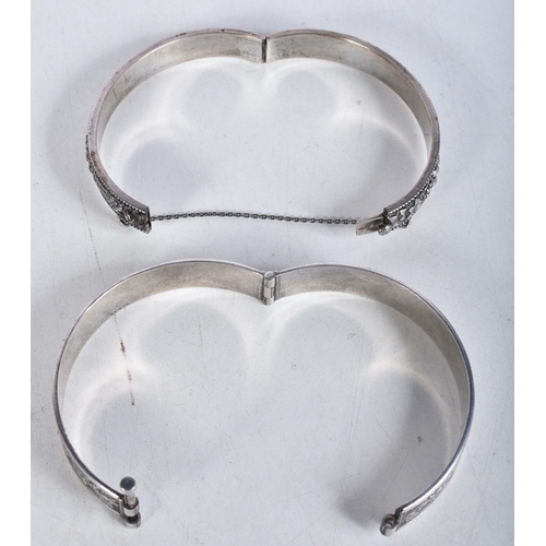 768 - Collection of Silver Bangles Inc. Floral, Safety Chain x 2 53g. 6.25 cm x 5.5 cm. (2)