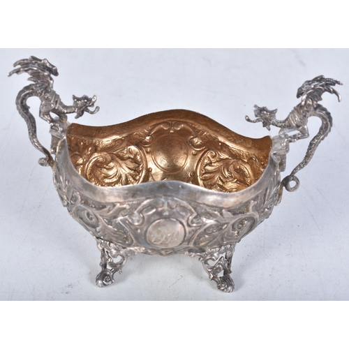 773 - stamped .800 silver twin handled dish w/ dragon detail. 93.2 grams. 11.75 cm x 7.75 cm.