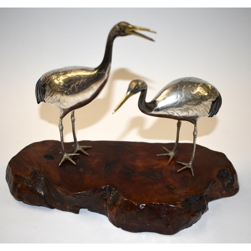 811 - A 19TH CENTURY JAPANESE MEIJI PERIOD SILVER MIXED METAL AND SHAKUDO OKIMONO modelled as cranes. 24 c... 