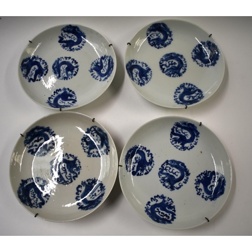 815 - FOUR 18TH/19TH CENTURY CHINESE BLUE AND WHITE DRAGON DISHES Qing. 17 cm diameter. (4)