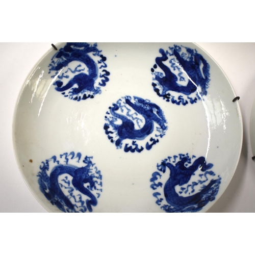 815 - FOUR 18TH/19TH CENTURY CHINESE BLUE AND WHITE DRAGON DISHES Qing. 17 cm diameter. (4)