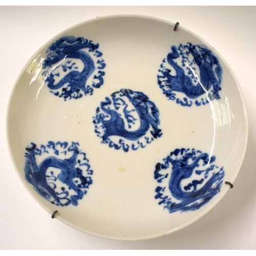 815 - FOUR 18TH/19TH CENTURY CHINESE BLUE AND WHITE DRAGON DISHES Qing. 17 cm diameter. (4)