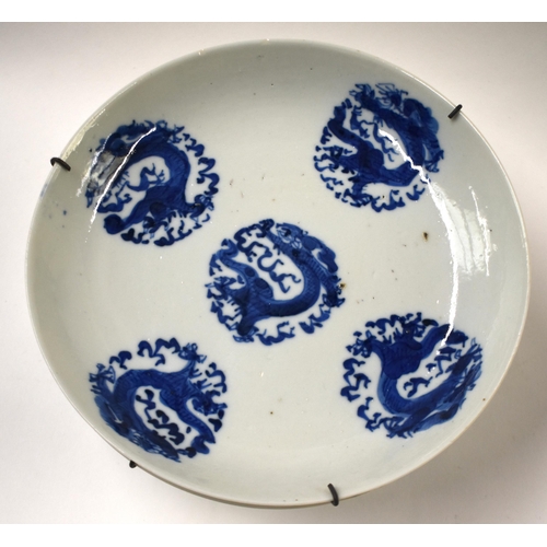 815 - FOUR 18TH/19TH CENTURY CHINESE BLUE AND WHITE DRAGON DISHES Qing. 17 cm diameter. (4)