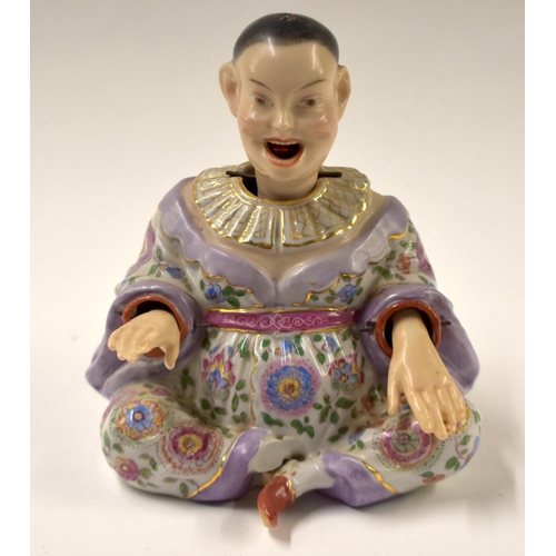 817 - A 19TH CENTURY GERMAN DRESDEN PORCELAIN NODDING HEAD FIGURE. 14 cm x 10 cm.