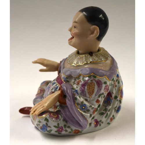 817 - A 19TH CENTURY GERMAN DRESDEN PORCELAIN NODDING HEAD FIGURE. 14 cm x 10 cm.