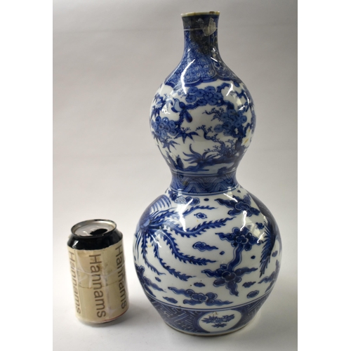 840 - A LARGE 19TH CENTURY JAPANESE MEIJI PERIOD BLUE AND WHITE GOURD VASE by Makuzu Kousai. 37 cm high.