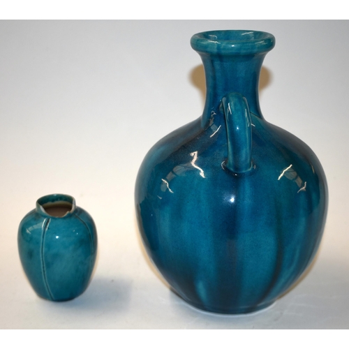 864 - A CHINESE QING DYNASTY TURQUOISE MONOCHROME PORCELAIN VASE together with a smaller vase. Largest 20 ... 