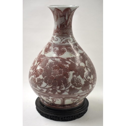 868 - A LARGE CHINESE IRON RED PAINTED YUHUCHUMPING VASE possibly 19th century, with fixed bronze base. 28... 