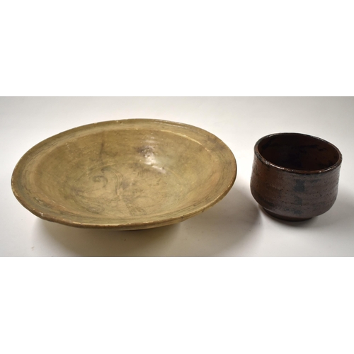 871 - AN EARLY CHINESE STONEWARE POTTERY BOWL Ming, together with another similar bowl. Largest 25 cm diam... 