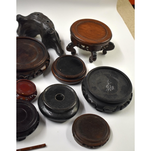 877 - ASSORTED CHINESE AND JAPANESE HARDWOOD STANDS. (qty)