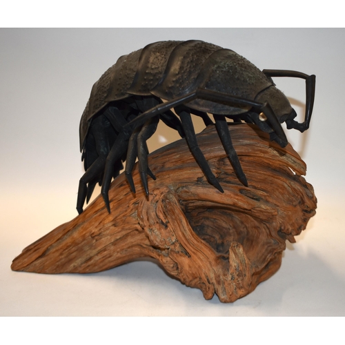 883 - AN EARLY 20TH CENTURY JAPANESE MEIJI PERIOD BRONZE OKIMONO modelled as a beetle roaming on a wooden ... 